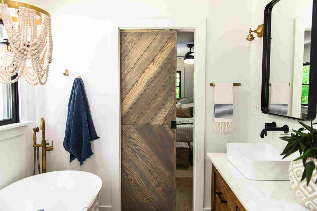 Farmhouse bathroom with contemporary door designs