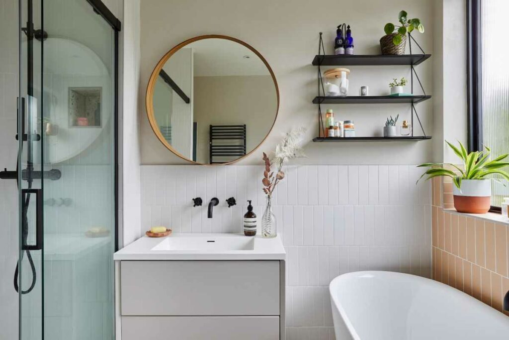 Neutral Bathroom With Wood Round Mirror